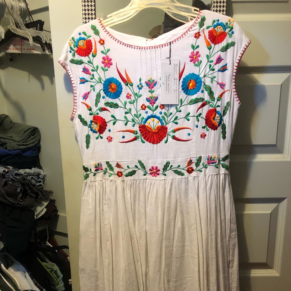 Embroidery dress, white with colorful flowers embroidered on it